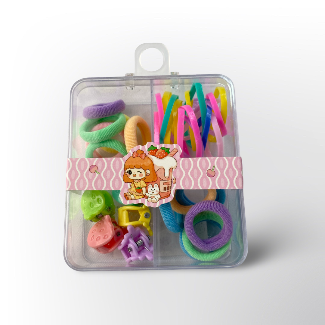 Set de Ligas y Mini Pinzas Multicolor 🎀✨ – Caja organizadora con ligas de colores variados (pastel y neón) y mini pinzas decorativas en forma de frutas y figuras, perfecto para peinados divertidos y llenos de color.